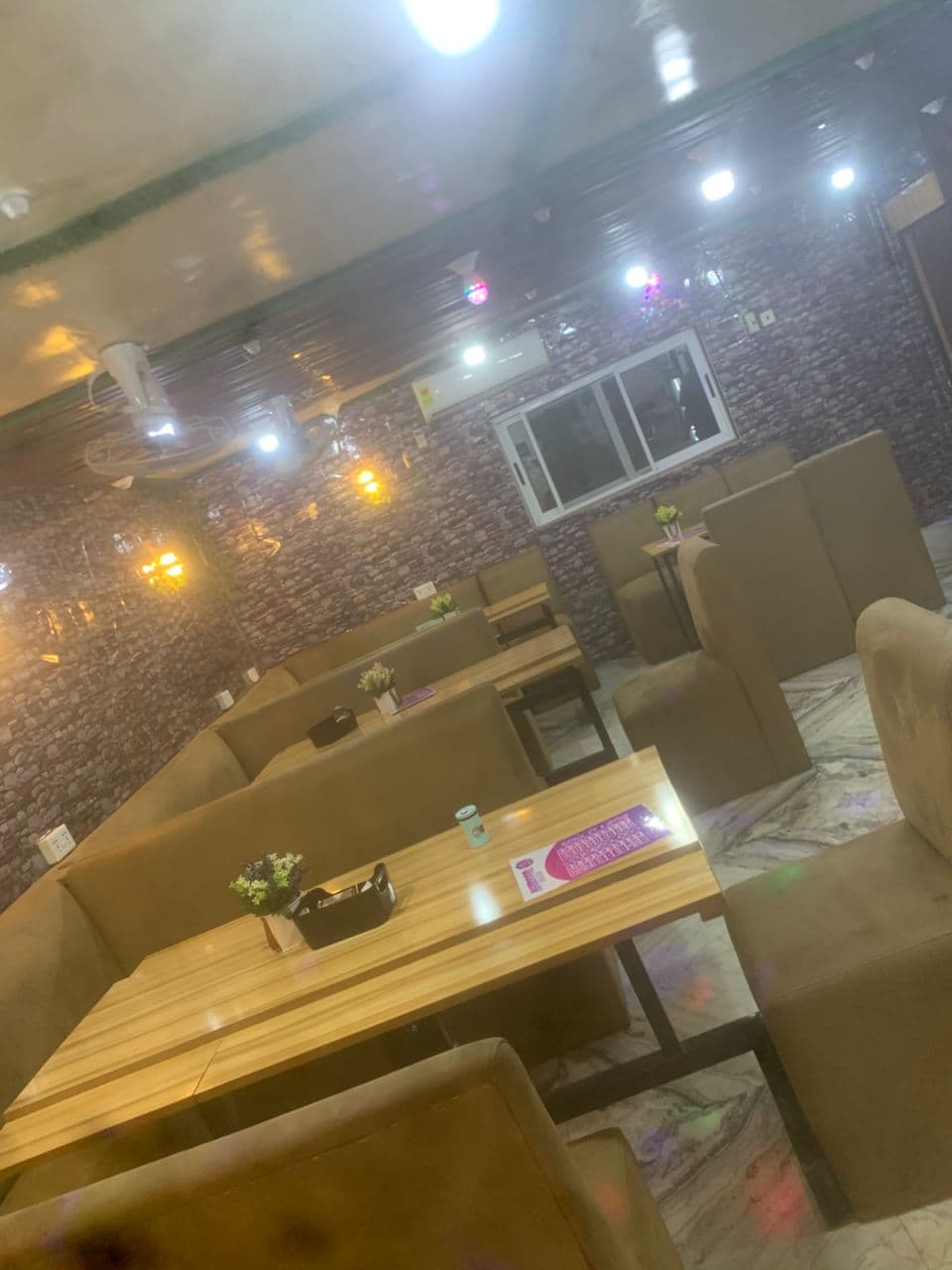 Elegant interior seating area with warm lighting at Alkidoor Restaurant